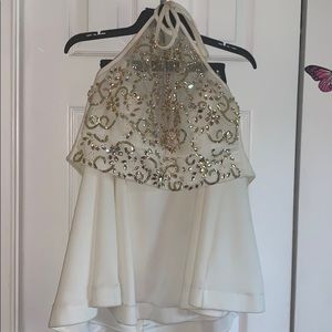 White and gold two piece crop top and skirt